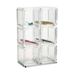 Clear acrylic pen and stationery organizer with six compartments on a white background
